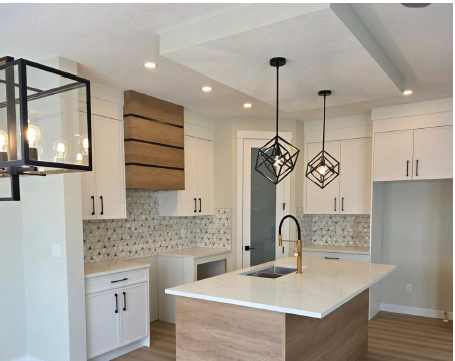 Finished kitchen with custom pendant lighting by North West Electric